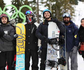 Five members of the Canada Drives Team on a snowboarding trip.