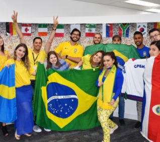 Canada Drives Team Members dress festively with international soccer jerseys and flags.